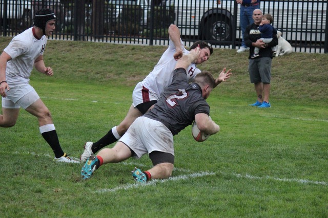 First Team All Ivy Selection, Brown University Hooker John Landers scores authoritatively against Harvard.