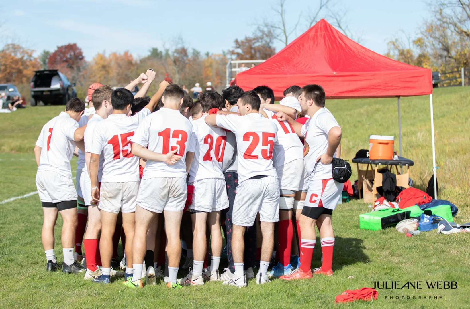 team gathers near tent before match