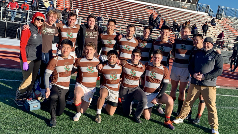 Brown Men's team posing on the field at William Patterson