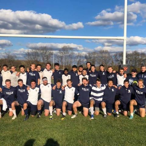 Yale Men team photo on a rugby field