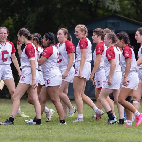 women take the field for a match