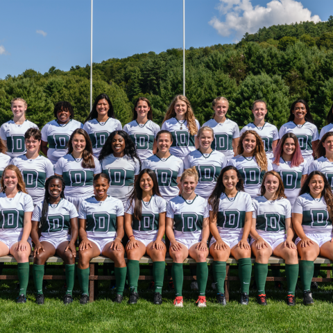 Dartmouth Women's rugby team posing on the field