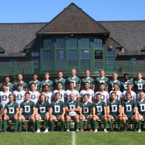 Dartmouth men's rugby team posing on the field