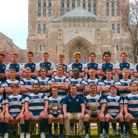 rugby team on Yale campus at Sterling Memorial Library