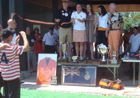 Paul and Heather Haaga cut ribbon at Haaga House, while daughter Blythe Haaga ‘05 looks on