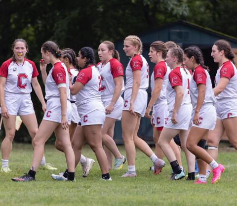 women take the field for a match