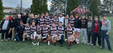 team surrounds Jay Fluck after 7s victory