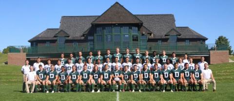 Dartmouth men's rugby team posing on the field