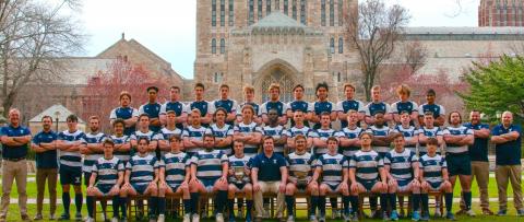 rugby team on Yale campus at Sterling Memorial Library