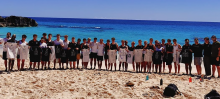 Dartmouth Heads to Bermuda 2024 players line up on the sand