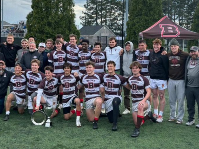 team surrounds Jay Fluck after 7s victory