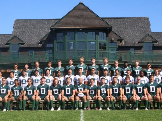 Dartmouth men's rugby team posing on the field