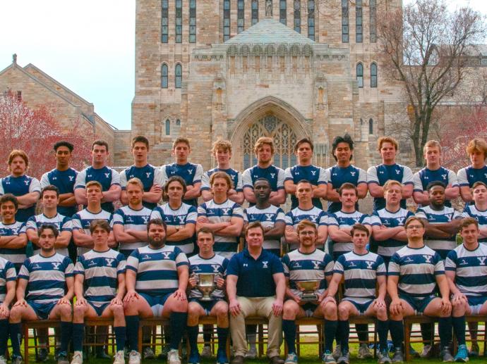 rugby team on Yale campus at Sterling Memorial Library